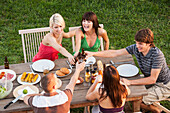 Friends eating together outdoors, Palma de Mallorca, Balearic Islands, Spain