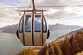 Ski lift overlooking mountain and lake, Queenstown, Queenstown, New Zealand