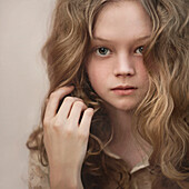 Caucasian girl playing with her hair, Nizniy Tagil, Sverdlovsk, Russia