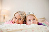 Senior Caucasian woman and granddaughter playing dress up, Jersey City, New Jersey, USA