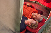 Senior Caucasian couple relaxing in tent, Los Angeles, California, United States