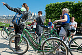 'France. Paris 4th district. The Marais; Place des Vosges : Touring cyclists and their guide'