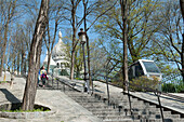 France. Paris 18th district. Montmartre. Dome of the Sacré-Cœur Basilica and the funicular of the staircases of the street of Cardinal Guibert