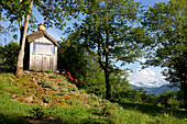 Wooden cabin in a mountain landscape