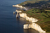 France, Seine-Maritime (76), Etretat, limestone cliffs have made it a place of international tourism (aerial view)