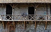 Saint Cere, Lot, stone facade, wooden balcony and old pram