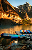 Mountain Lake With Canoes