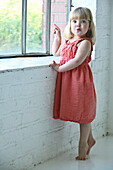 Young Girl Pointing Out The Window