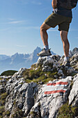Male Hiker With A Trail Marker (Blaze) On A Rock, Grodig, Salzburger Land, Austria