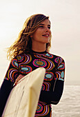 'Young Woman With Her Surfboard; Tarifa, Cadiz, Andalusia, Spain'