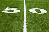 The 50 Yard Line Marked On A Football Field
