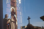 'Buenos Aires, Argentina; A Stained Glass Window Depicting Jesus With A Reflection Of A Cross In Recoleta Cemetery'