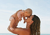 'A Mother With Her Baby; Benalmadena Costa, Costa Del Sol, Malaga, Andalusia, Spain'