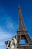 'Horse Statue And The Eiffel Tower Against A Blue Sky; Paris, France'