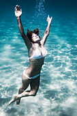 'A Woman Floating Underwater; Tarifa, Cadiz, Andalusia, Spain'
