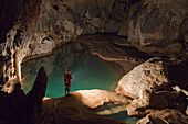 'A Filipino Tour Guide Holds A Lantern Inside Sumaging Cave Or Big Cave Near Sagada; Luzon, Philippines'