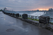 Sunrise Over The American Falls With The Niagara Falls Promenade In The Foreground - Niagara Falls, Ontario, Canada