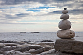 'Pile Of Rocks Balanced On A Boulder At The Water's Edge; South Shields, Tyne And Wear, England'