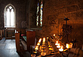 'Candles Lit Inside A Church Sanctuary; Bamburgh, Northumberland, England'
