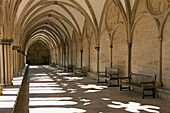 'A covered corridor with benches and a dome ceiling;Salisbury england'