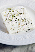 Sliced Feta Cheese Sprinkled With Dried Oregano