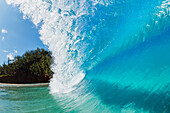 'Blue ocean wave with a view of trees along the coast,Hana, maui, hawaii, united states of america'