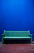 'A painted green bench along a blue wall;Marrakech, morocco'