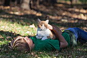 'Boy holding his cat;Gimli manitoba canada'