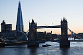 'A Bridge Crossing The River Thames And The Shard In The Background; London, England'