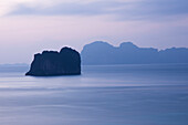 'Uninhabited island off the coast of the island of Koh Ngai at dusk; Thailand'