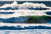 'Waves break on the shore; Cannon Beach, Oregon, United States of America'