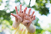 'Young girl's hands outstretched and fingers spread; Toronto, Ontario, Canada'