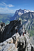 Two mountaineers on the ridge of Ostegg, Eiger (3970 m), Bernese Alps, Switzerland