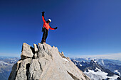 Mountaineer on the summit of Mont Maudit, Mont Blanc Group, France