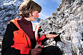 walker feeding alpine chough, Wettersteingebirge, Germany