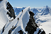 Mountaineers on the ridge of Blümlisalp, traverse of Blümlisalp (3661 m), Bernese Alps, Switzerland