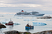 Fishing boats in harbor and cruise ship, Ilulissat Kangerlua Icefjord, Ilulissat, Qaasuitsup, Greenland
