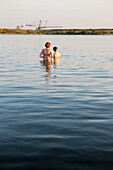 Two people bathing in lake Markkleeberg, Markkleeberg, Saxony, Germany
