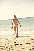 Woman going snorkeling, Praia, Santiago, Cape Verde