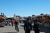 Djemaa el Fna during the day with the High Atlas mountains in the background, Marrakech, Morocco