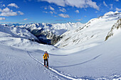 Female back-country skier ascending to Grosser Moeseler, Zillertal Alps, South Tyrol, Italy