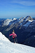 Female back-country skier ascending to Birkkarspitze, Karwendel range, Tyrol, Austria