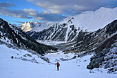 Female back-country skier ascending to Grosser Moeseler, Zillertal Alps, South Tyrol, Italy