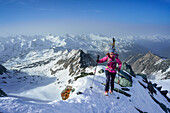 Female back-country skier ascending to Grossglockner, Glockner Group, High Tauern National Park, East Tyrol, Tyrol, Austria