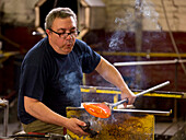 A glassblower showing his craft in the Murano Glass Factory Ellegi Glas, Murano, near Venice, Veneto, Italy, Europe
