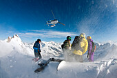 Skier watching at a helicopter, Valgrisenche, Aosta Valley, Italy