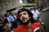 Che Guevara impersonator, Jose Lopez waits near a polling station for President Hugo Chavez to arrive on February, 15, 2009 in a slum in Caracas, Venezuela. Chavez asked Venezuelans to vote on a proposed amendment to their National Constitution to abolish