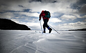 Skiing on the frozen tundra of Moosehead Lake, Maine.