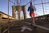 The Brooklyn Bridge in the early morning is a popular destination for New York joggers.   New York City, NY, May 13, 2008