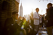 People gather during the late afternoon for a drink at the Rare View Roof Top Bar, which offers spectacular panoramic views of the city.   New York City, NY, May 13, 2008